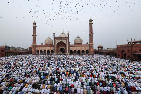 Muslims offer Eid al-Fitr prayers at Jama Masjid to mark the end of the holy fasting month of Ramadan, in the old quarters of Delhi