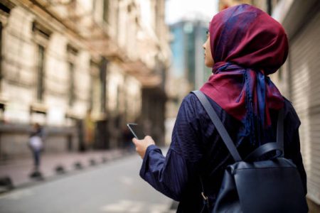 Muslim tourist exploring city
